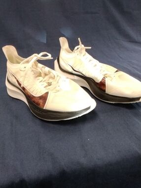 Nike Women's White Athletic Sneakers with Brown Accent